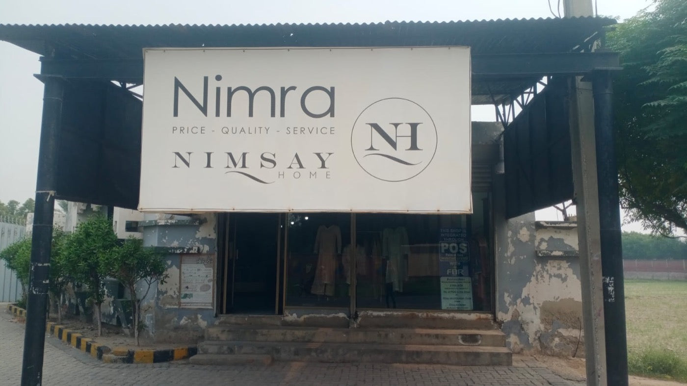 Nimra shopfront with the sign reading Price, Quality, Service